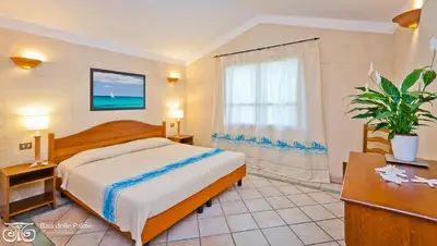 Letto o letti in una camera di Classical Residence Baia delle Palme Premium num1212