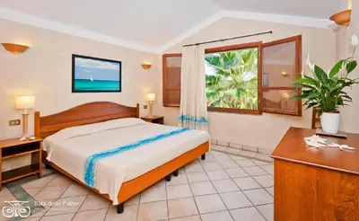 Letto o letti in una camera di Classical Residence Baia delle Palme Premium Bilo 4 nm1213