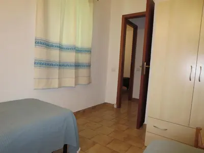 Letto o letti in una camera di Villetta Sunrise 35