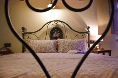Letto o letti in una camera di B &B Inn - COME UN PICCOLO HOTEL- CAMERE CON BAGNO PRIVATO-PARCHEGGIO INTERNO PER MOTO e BICI -ENERGETIC BREAKFAST extra