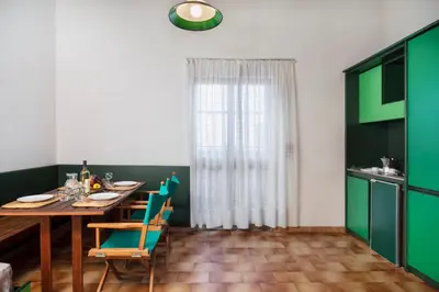 Cucina o angolo cottura di ISA-Ecovillage with swimming-pool in Teulada surrounded by greenery just 400 meters from the sea