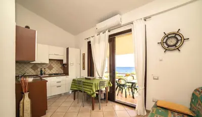 Cucina o angolo cottura di Village in Porto Corallo just 200 meters from the beach, apartments with private outdoor area