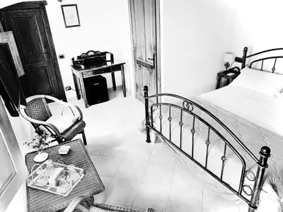 Letto o letti in una camera di Prestige Room- Salotto Interno- Frigobar- Esperienze Esclusive nel Territorio - Tutti i confort