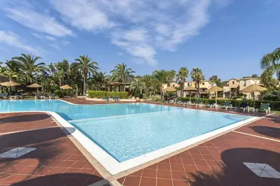 Piscina di Tropical Residence In Santa Margherita Di Pula o nelle vicinanze