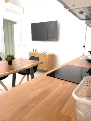 TV o dispositivi per l'intrattenimento presso Luxi Apartment Teulada