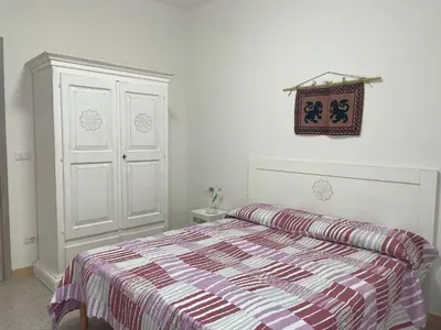 Letto o letti in una camera di Affitta camere - Casa vacanze Domu e Mari