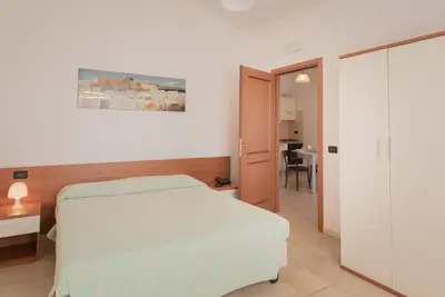 Letto o letti in una camera di Stylish Residence Le Fontane 2 BedrApt T5 sleeps 5