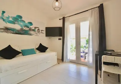 Letto o letti in una camera di ISA - Residence in Costa Rei just 450 meters from the beach, apartments with air conditioning and outdoor private area