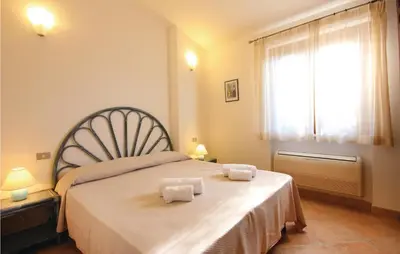 Letto o letti in una camera di Cozy Home In Costa Rei -Ca- With Wifi