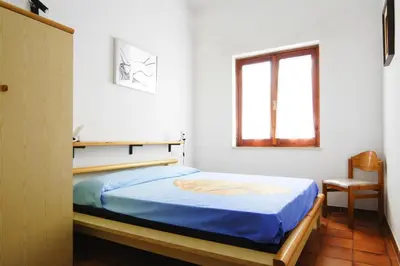Letto o letti in una camera di Apartment on Costa Rei near Sandy Beach
