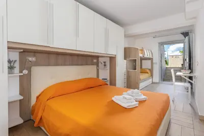 Letto o letti in una camera di APPARTAMENTO 5 pers PARCHEGGIO