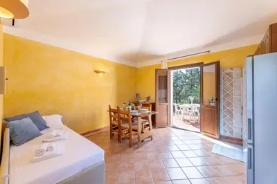 Letto o letti in una camera di Baia delle Palme residence