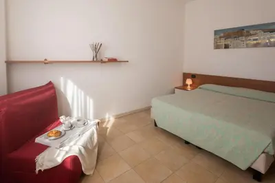 Letto o letti in una camera di Residence Le Fontane